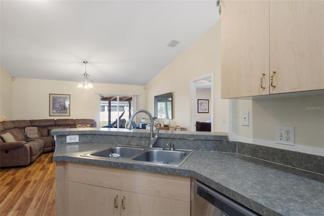 723 Pelican Ct, Kissimmee, FL 34759 - kitchen with dishwasher, light brown cabinets, open floor plan, and a sink