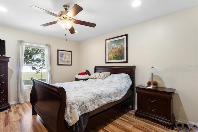 723 Pelican Ct, Kissimmee, FL 34759 - bedroom with ceiling fan, baseboards, and light wood-style flooring