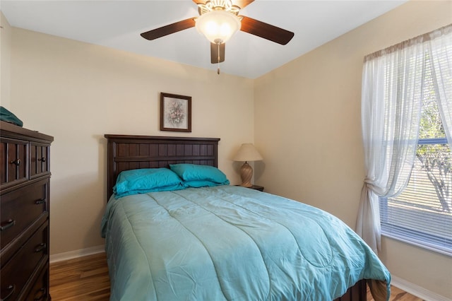 723 Pelican Ct, Kissimmee, FL 34759 - bedroom featuring a ceiling fan, wood finished floors, and baseboards