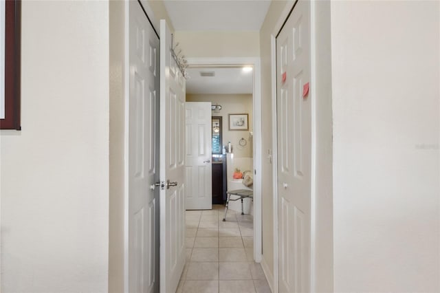 723 Pelican Ct, Kissimmee, FL 34759 - hallway with light tile patterned floors and visible vents
