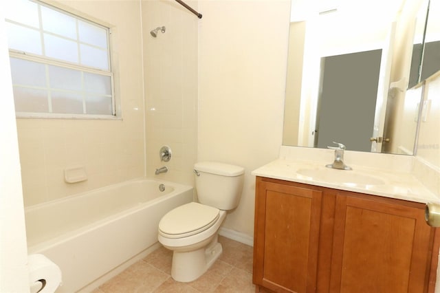 bathroom featuring tile patterned flooring, vanity, toilet, baseboards, and tub / shower combination