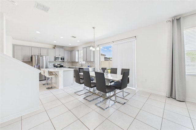 2090 Prairie Sage Ln, Longwood, FL 32750 - dining space featuring baseboards, visible vents, recessed lighting, and light tile patterned floors