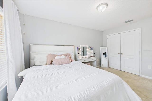 2090 Prairie Sage Ln, Longwood, FL 32750 - bedroom with carpet, baseboards, a textured ceiling, visible vents, and a closet