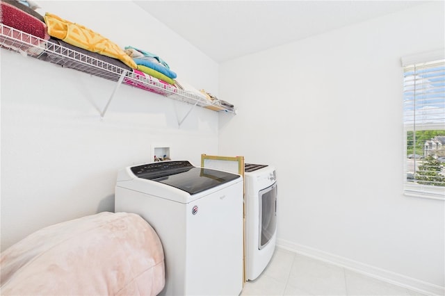 2090 Prairie Sage Ln, Longwood, FL 32750 - laundry room featuring light tile patterned floors, baseboards, laundry area, and washer and dryer