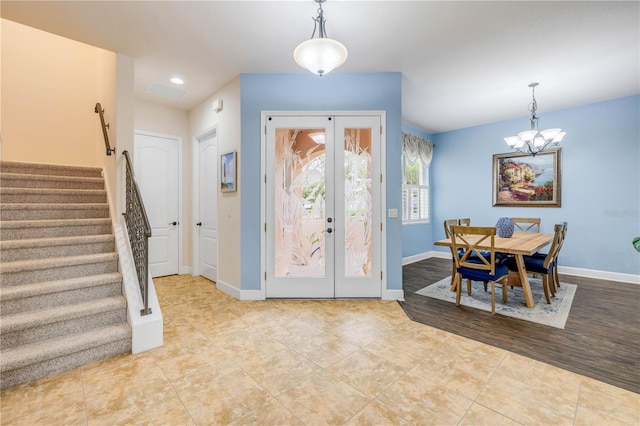3145 Connemara Dr, Ormond Beach, FL 32174 - entrance foyer featuring stairway, tile patterned flooring, a chandelier, baseboards, and recessed lighting