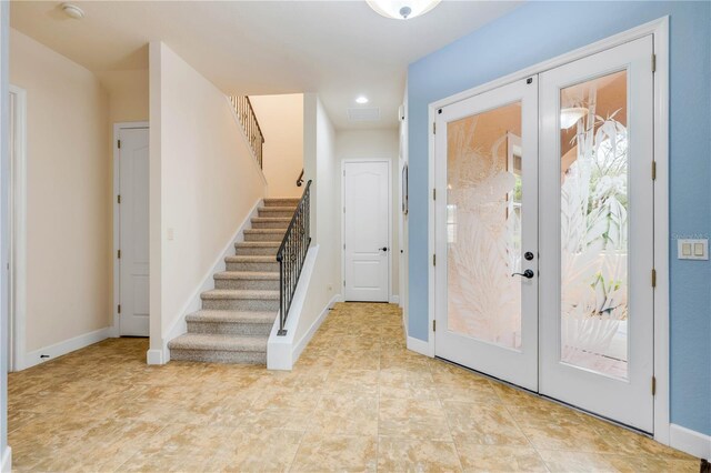 3145 Connemara Dr, Ormond Beach, FL 32174 - entryway featuring stairs, french doors, baseboards, and recessed lighting