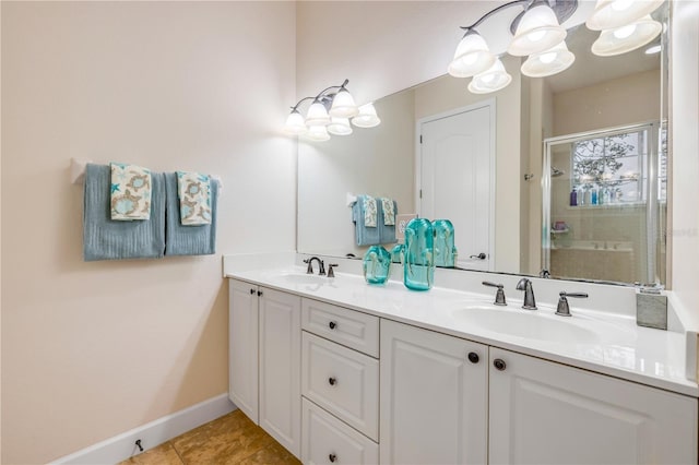 3145 Connemara Dr, Ormond Beach, FL 32174 - full bath featuring a shower stall, double vanity, baseboards, and tile patterned flooring