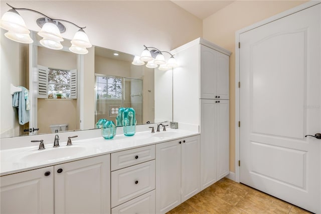 3145 Connemara Dr, Ormond Beach, FL 32174 - full bathroom featuring toilet, a shower stall, double vanity, and tile patterned floors