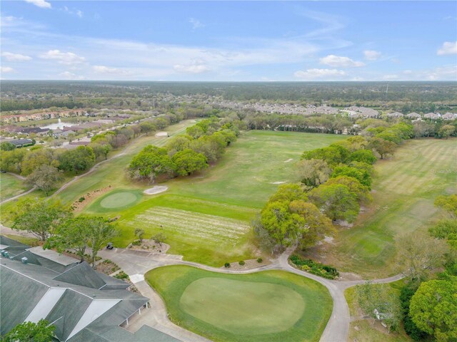 3145 Connemara Dr, Ormond Beach, FL 32174 - aerial overview of property's location with a golf course, nearby suburban area, and a tree filled landscape
