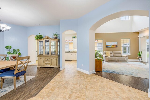 3145 Connemara Dr, Ormond Beach, FL 32174 - dining area featuring arched walkways and plenty of natural light