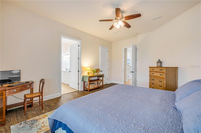 3145 Connemara Dr, Ormond Beach, FL 32174 - bedroom featuring wood finished floors, baseboards, an office area, connected bathroom, and a ceiling fan