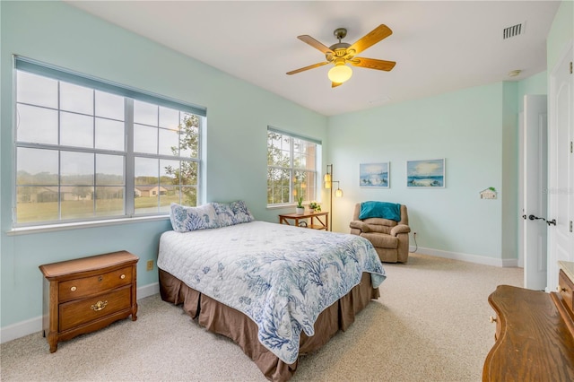 3145 Connemara Dr, Ormond Beach, FL 32174 - bedroom with carpet, baseboards, and ceiling fan