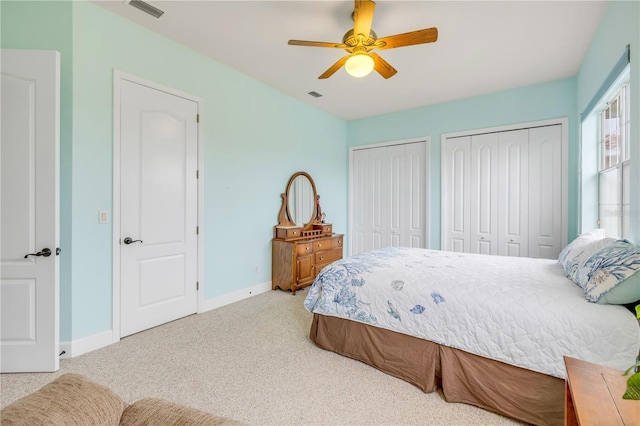 3145 Connemara Dr, Ormond Beach, FL 32174 - carpeted bedroom with multiple closets, baseboards, and a ceiling fan