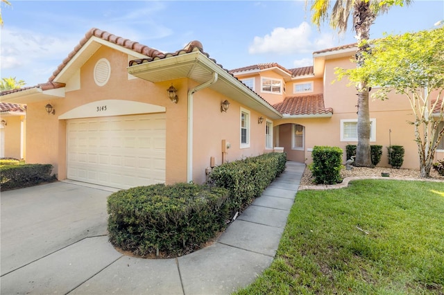 3145 Connemara Dr, Ormond Beach, FL 32174 - mediterranean / spanish-style home with a tiled roof, stucco siding, a front yard, and concrete driveway