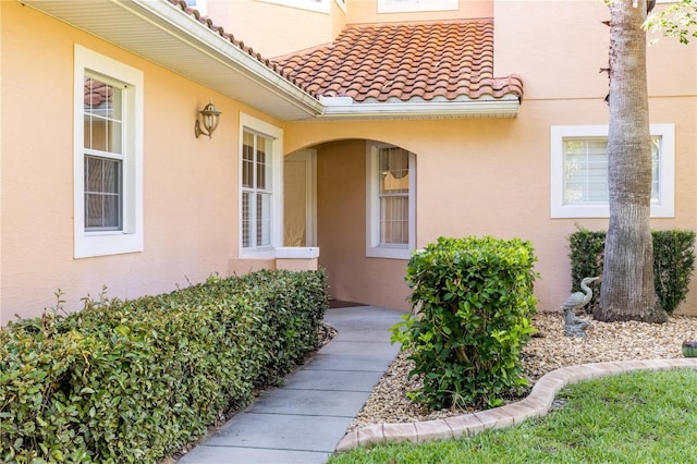 3145 Connemara Dr, Ormond Beach, FL 32174 - view of exterior entry featuring stucco siding