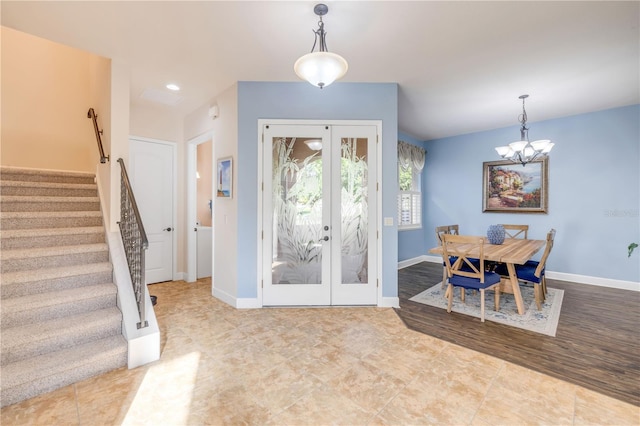 3145 Connemara Dr, Ormond Beach, FL 32174 - tiled foyer entrance featuring stairway, a chandelier, french doors, and recessed lighting