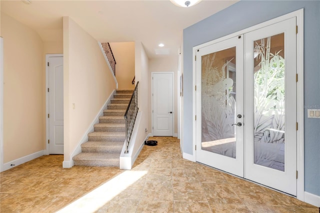 3145 Connemara Dr, Ormond Beach, FL 32174 - entrance foyer with stairs, french doors, and recessed lighting