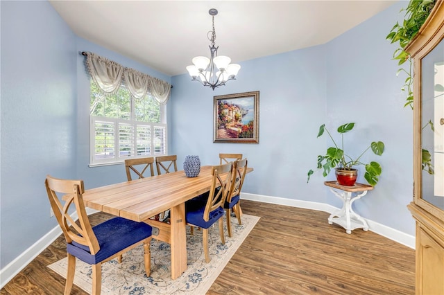 3145 Connemara Dr, Ormond Beach, FL 32174 - dining space with a chandelier and wood finished floors