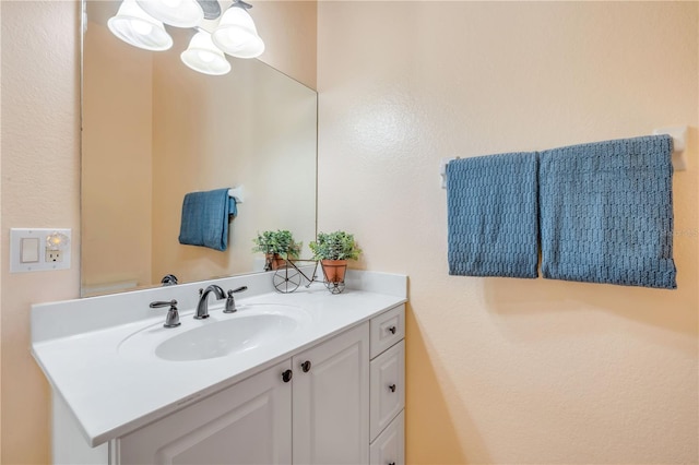 3145 Connemara Dr, Ormond Beach, FL 32174 - bathroom with vanity and a chandelier