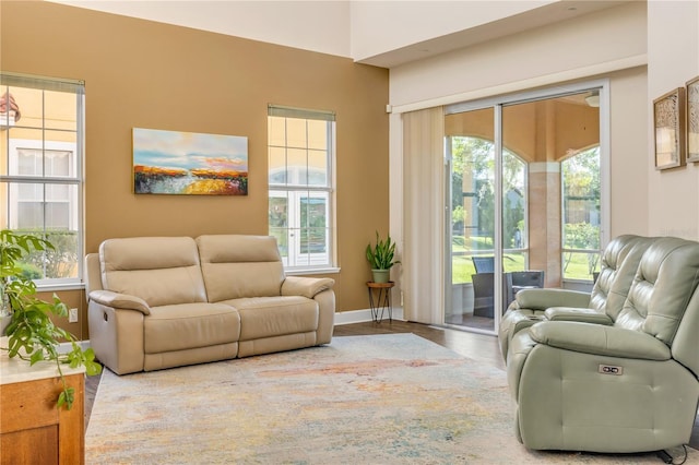 3145 Connemara Dr, Ormond Beach, FL 32174 - living area featuring healthy amount of natural light and wood finished floors