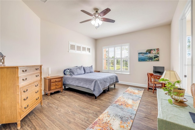 3145 Connemara Dr, Ormond Beach, FL 32174 - bedroom with multiple windows, light wood-style floors, and a ceiling fan