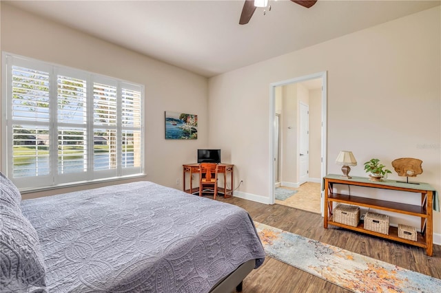 3145 Connemara Dr, Ormond Beach, FL 32174 - bedroom with wood finished floors and ceiling fan