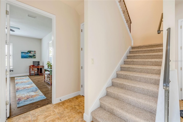 3145 Connemara Dr, Ormond Beach, FL 32174 - stairs featuring a ceiling fan and tile patterned flooring