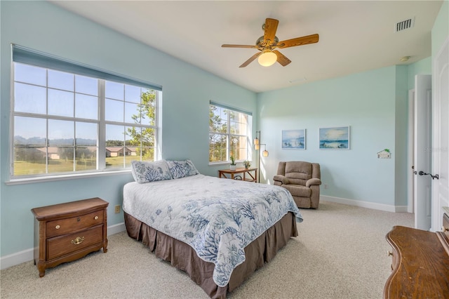 3145 Connemara Dr, Ormond Beach, FL 32174 - bedroom with light carpet and a ceiling fan