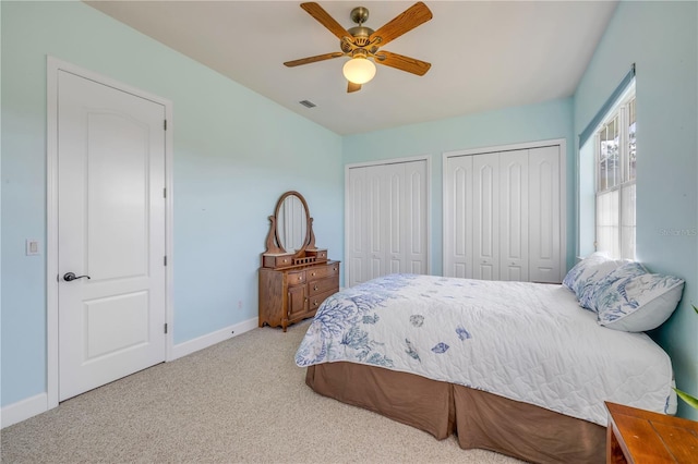 3145 Connemara Dr, Ormond Beach, FL 32174 - carpeted bedroom featuring multiple closets and a ceiling fan