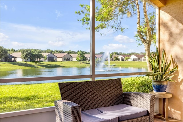 3145 Connemara Dr, Ormond Beach, FL 32174 - sunroom / solarium featuring a water view and a residential view