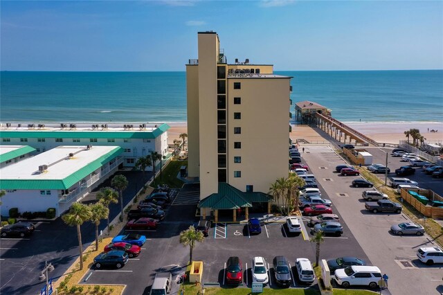 birds eye view of property featuring a water view and a view of the beach
