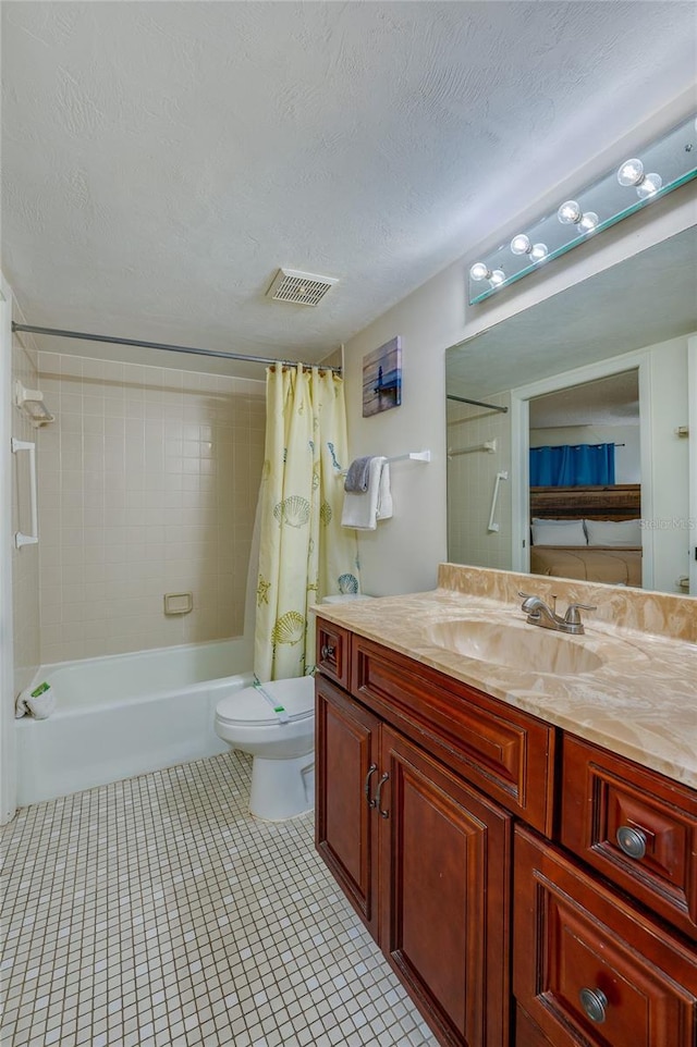 bathroom with shower / bath combo, visible vents, toilet, vanity, and tile patterned floors