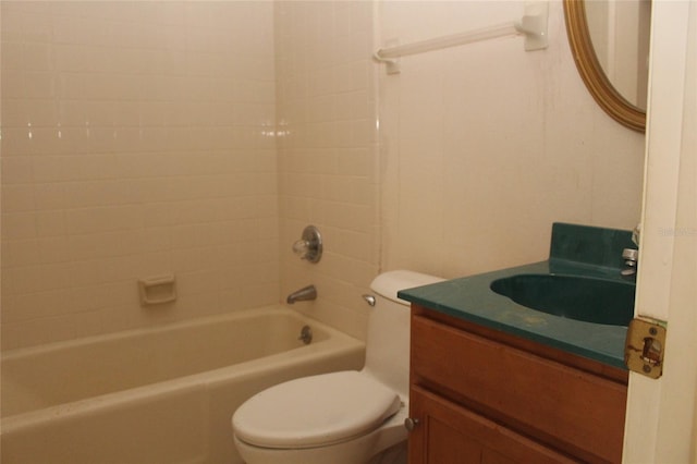 bathroom with toilet, vanity, and washtub / shower combination