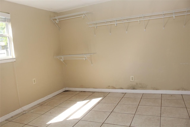 spacious closet with light tile patterned flooring