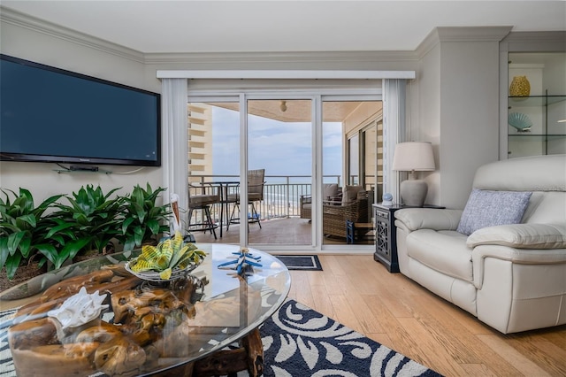2967 S Atlantic Ave Unit 301, Daytona Beach Shores, FL 32118 - living room with light wood finished floors and crown molding