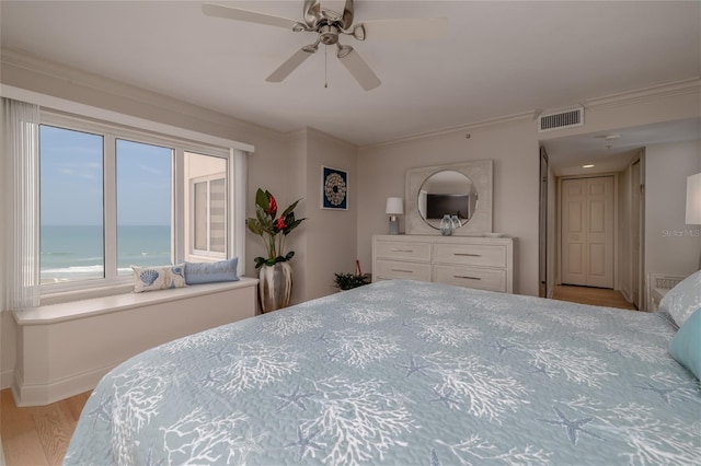 2967 S Atlantic Ave Unit 301, Daytona Beach Shores, FL 32118 - bedroom with wood finished floors, crown molding, a water view, baseboards, and a ceiling fan