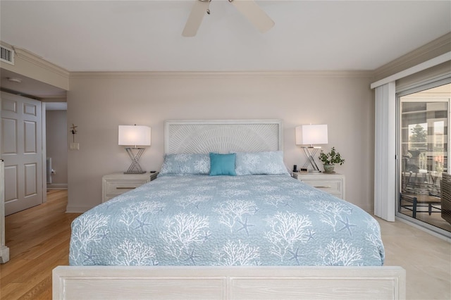 2967 S Atlantic Ave Unit 301, Daytona Beach Shores, FL 32118 - bedroom featuring access to exterior, ornamental molding, baseboards, and ceiling fan