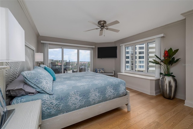 2967 S Atlantic Ave Unit 301, Daytona Beach Shores, FL 32118 - bedroom with baseboards, light wood-style floors, access to exterior, ornamental molding, and a ceiling fan
