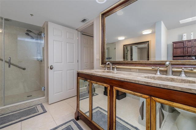 2967 S Atlantic Ave Unit 301, Daytona Beach Shores, FL 32118 - bathroom featuring a stall shower, tile patterned flooring, and double vanity