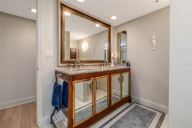 2967 S Atlantic Ave Unit 301, Daytona Beach Shores, FL 32118 - full bathroom with double vanity, baseboards, and recessed lighting