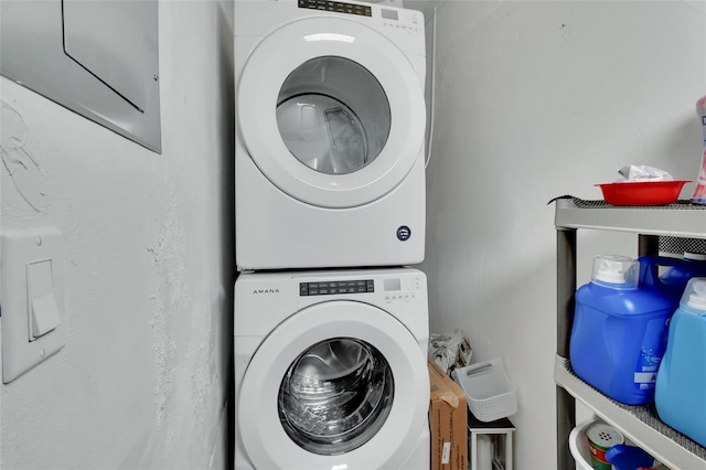 laundry area featuring laundry area and stacked washer / drying machine