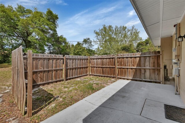 view of yard with a fenced backyard and a patio