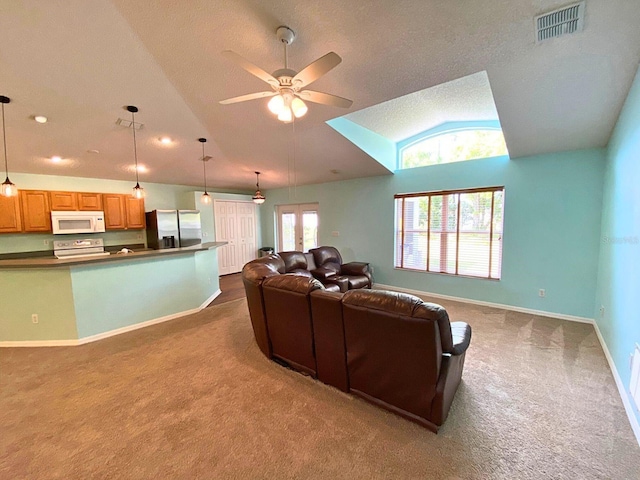 living room featuring visible vents, baseboards, ceiling fan, vaulted ceiling, and dark colored carpet