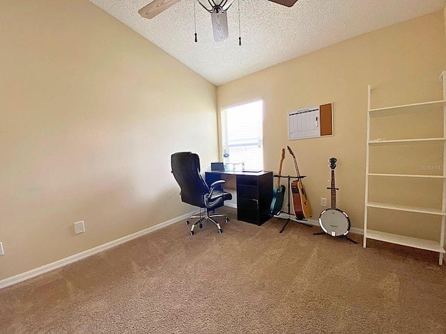 office area with carpet flooring, a textured ceiling, vaulted ceiling, and ceiling fan