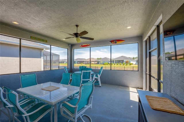 418 Aquamarine Way, Daytona Beach, FL 32124 - sunroom / solarium with outdoor dining area, a ceiling fan, and a residential view