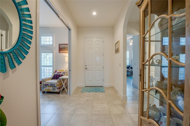 418 Aquamarine Way, Daytona Beach, FL 32124 - foyer featuring arched walkways, baseboards, and light tile patterned floors