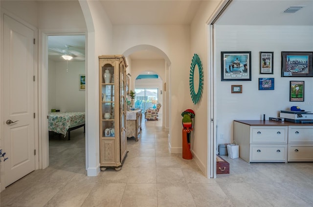 418 Aquamarine Way, Daytona Beach, FL 32124 - hall featuring baseboards, visible vents, and arched walkways