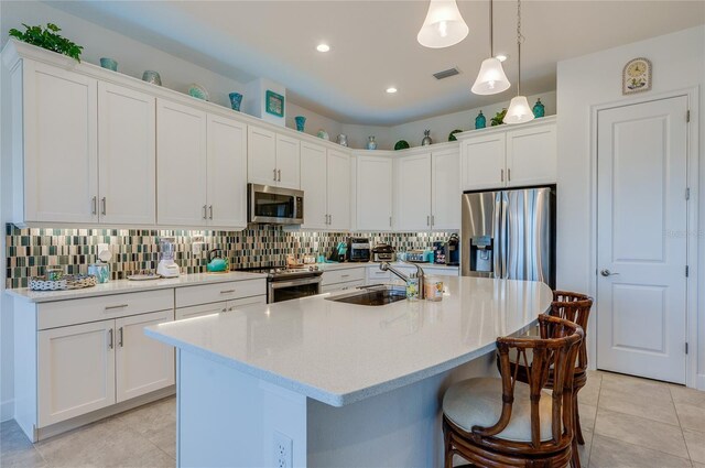 418 Aquamarine Way, Daytona Beach, FL 32124 - kitchen featuring white cabinetry, a sink, appliances with stainless steel finishes, and decorative backsplash