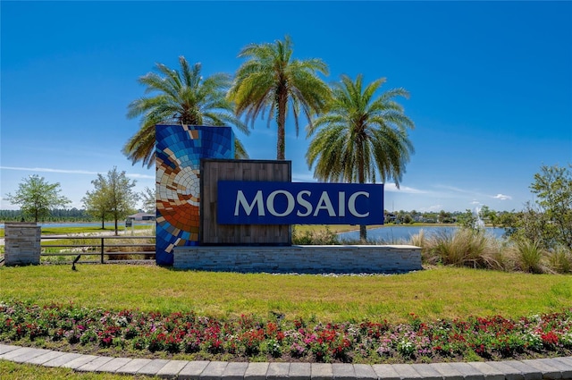 418 Aquamarine Way, Daytona Beach, FL 32124 - community sign with a lawn, a water view, and fence