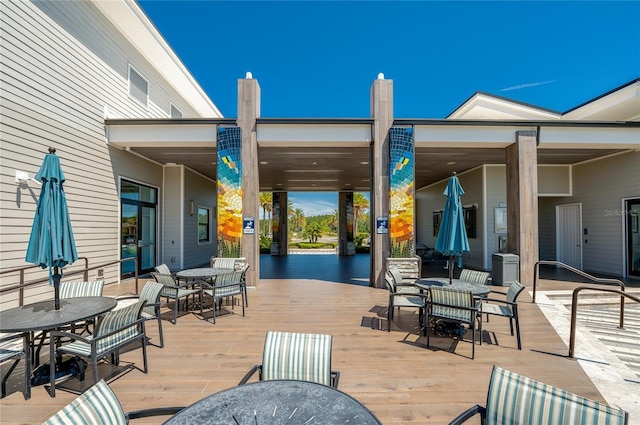 418 Aquamarine Way, Daytona Beach, FL 32124 - wooden deck with outdoor dining area